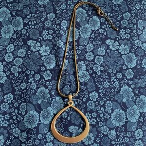 60’s vibe gold tone necklace with loop pendant. VGUC.